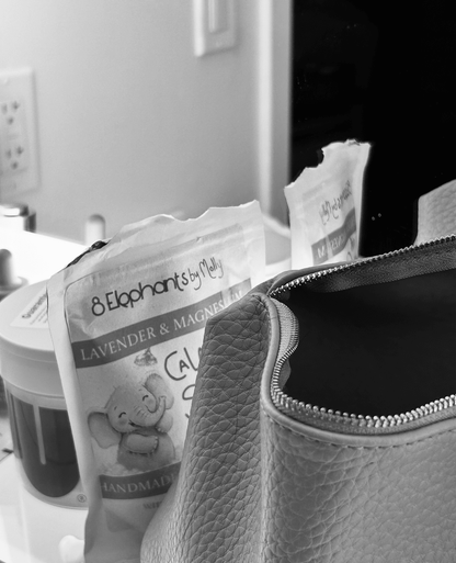 calm body salts in a black-and-white bathroom shelfie