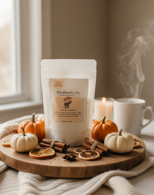 Bag of mineral bath fizz on a wooden board with pumpkins, cinnamon, and a lit candle in a cozy setting.